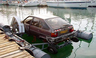 A very shonky car floating on pontoons